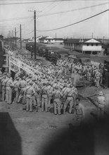 Group of Soldiers Boarding Trucks, Awaiting Departure for East Coast USA with Eventual Departure by Ship to Europe, WWII, HQ 2nd Battalion, 389th Infantry, US Army Military Base, Indiana, USA, 1942