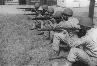 Group of Soldiers in Kneeling Position Displaying Proper Shooting Position During Training Session, WWII, 2nd Battalion, 389th Infantry, US Army Military Base Indiana, USA, 1942