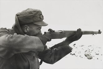 Soldier Shooting Rifle during Target Practice, Close Up, WWII, HQ 2nd Battalion, 389th Infantry, US Army Military Base, Indiana, USA, 1942