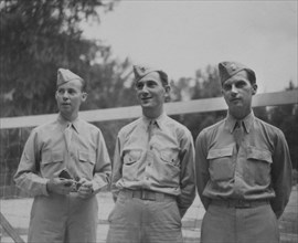 Three Soldiers in Uniform in Front of Volleyball Net, Portrait, WWII, HQ 2nd Battalion, 389th Infantry, US Army Military Base, Indiana, USA, 1942