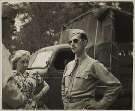 Soldier in Uniform and Aviator Sunglasses with Another Soldier and Civilian Woman, Portrait, WWII, HQ 2nd Battalion, 389th Infantry, US Army Military Base, Indiana, USA, 1942