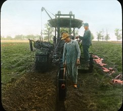 Farmers Digging Ditch with Tractor and Laying Drain Tile, Wisconsin, USA, Magic Lantern Slide, circa 1915