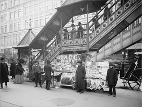 Newspaper Vendor at Elevated Train Stairway, New York City, New York, USA, Detroit Publishing Company, 1903