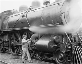 Mechanic Oiling Gears on Train, USA, Detroit Publishing Company, 1904