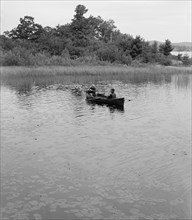 Two Men in Canoe Among Lily Pads, Whitefish Bay, Ontario, Canada, Detroit Publishing Company, 1905