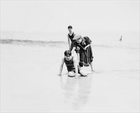 Two Young Men and Woman Having Fun at Beach, Coney Island, New York, USA, Detroit Publishing Company, 1900