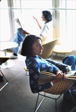 Profile of Mid-Adult Woman Sitting in Café on Cruise Ship, circa 1970's