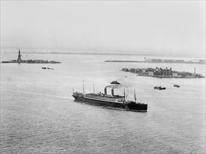 Statue of Liberty, Ellis Island and Ship in Harbor, New York City, New York, USA, Detroit Publishing Company, 1910