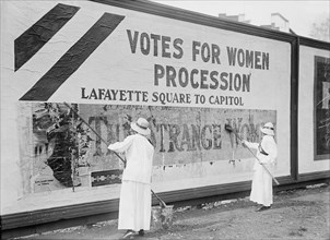 Two Women Putting Up Poster for Women's Suffrage Parade, Washington DC, USA, Harris & Ewing, 1914