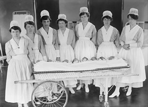 Group of Nurses with Newborn Babies, Harris & Ewing, 1916