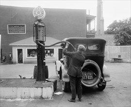 Man Putting Gas in Car at Gas Station, Washington DC, USA, Harris & Ewing, 1920