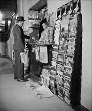 Man Buying Newspaper at Newsstand, Washington DC, USA, Harris & Ewing, 1940