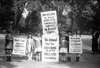 Children Protestors with Signs, "Mr. Wilson is Busy Protecting America's Enemy, The British Empire," etc., Washington DC, USA, Harris & Ewing, 1915