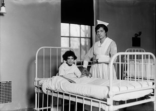 Nurse Checking Child's Pulse in Hospital, Portrait, Harris & Ewing, 1915