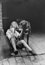 Sad Boy with Dog, USA, Harris & Ewing, 1921