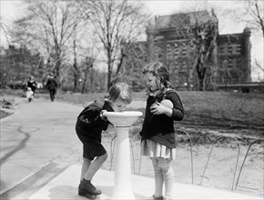 Two Children at Water Fountain in Park, Washington DC, USA, Harris & Ewing, 1924