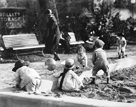 Group of Children Playing in Playground Sandbox, USA, Harris & Ewing, 1920