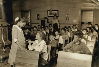 Older Student Conducting Daily Inspection of Teeth and Finger Nails of other Students under the Direction of Teacher, Lawton, Oklahoma, USA, Lewis Hine, 1917