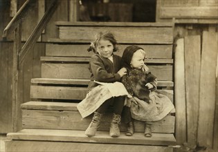 Portrait of Young Girl Taking Care of Baby Sister While Rest of Family is Working at Local Cannery, Bayou La Batre, Alabama, USA, Lewis Hine, 1911
