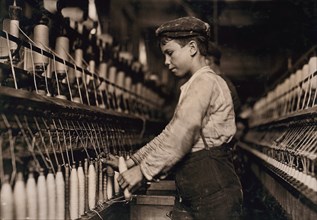 Young Boy Working as Doffer in Globe Cotton Mill, Augusta, Georgia, USA, Lewis Hine, 1909