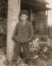 Portrait of John Holland, 10-year-old Boy, Worker at Deep River Mill rolling Bobbins, Randleman, North Carolina, USA, Lewis Hine, 1913