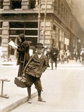 Portrait of Bundle Boy on Street, Saint Louis, Missouri, USA, Lewis Hine, 1910