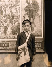 Portrait of 12-year-old Newsboy, Works at Candy Store in Addition to Selling Newspapers, Works 7 Days-a-Week, Wilmington, Delaware, USA, Lewis Hine, 1910