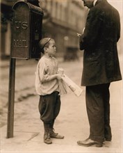 7-year-old Newsboy Selling Newspaper to Man, Works Every Day 2:30 to 8pm, 10am to Midnight on Saturday Earning 50 Cents per Day, Philadelphia, Pennsylvania, USA, Lewis Hine, 1910