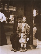 Young Girl and Elderly Man Begging, 6th Avenue and 14th Street, New York City, New York, USA, Lewis Hine, 1910