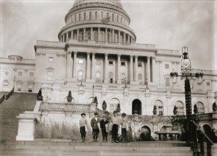 Group of Young Newsboys Selling Newspapers on Steps of U.S. Capitol Building, Washington DC, USA, Lewis Hine, 1912