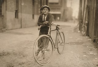Portrait of Young Messenger Boy with Bicycle Smoking Pipe, Mackay Telegraph Company, Waco, Texas, USA, Lewis Hine, 1913