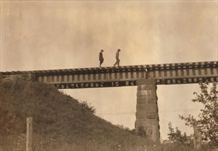Two Young Boys Walking Along Elevated Train Track, Westfield, Massachusetts, USA, Lewis Hine, 1916