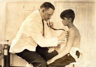 Doctor Examining Young Mill Worker, Cheney Silk Mills, South Manchester, Connecticut, USA, Lewis Hine, 1924