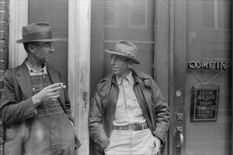 Two Farmers Talking in front of Bank, Roxboro, North Carolina, USA, Jack Delano for Farm Security Administration, May 1940