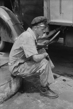 Attendant at Truck Service Station, U.S. 1, Washington DC, USA, Jack Delano for Farm Security Administration, circa 1940
