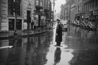 Traffic Cop on Rainy Day, Norwich, Connecticut, USA, Jack Delano for Farm Security Administration/Office of War Information, November 1940
