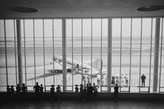 Visitors Watching Airplanes through Window of Main Waiting Room at Municipal Airport, Washington DC, USA, Jack Delano for Farm Security Administration, July 1941