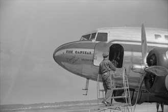 Loading Baggage onto Airplane, Municipal Airport, Washington DC, USA, Jack Delano for Farm Security Administration, July 1941