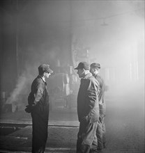 Three Workers in the Roundhouse at Chicago and Northwestern Railroad Yard, Chicago, Illinois, USA, Jack Delano for Office of War Information, December 1942