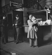 Woman and Baby Waiting for Train in Concourse of Union Station, Parmelee Transfer Sign, Chicago, Illinois, USA, Jack Delano for Office of War Information, January 1943