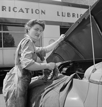 Miss Frances Heisler, a Garage Attendant at the Atlantic Refining Company Garages, Philadelphia, Pennsylvania, USA, Jack Delano for Office of War Information, June 1943