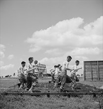 Enlisted Men Going Through Obstacle Course, Air Service Command, Daniel Field, Georgia, USA, Jack Delano for Office of War Information, July 1943