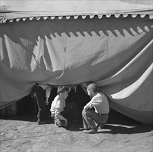 Children Sneaking Under Circus Tent, Roswell, New Mexico, USA, Arthur Rothstein for Farm Security Administration, April 1936