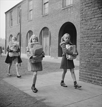 Girls Bringing Their Weekly Contribution of Scrap Paper to School during Scrap Salvage Campaign, Victory Program, Washington DC, USA, Marjorie Collins for Office of War Information, August 1942