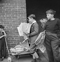 Boys Bringing Their Weekly Contribution of Scrap Paper to School during Scrap Salvage Campaign, Victory Program, Washington DC, USA, Marjorie Collins for Office of War Information, August 1942