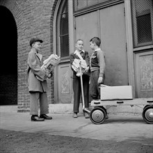 Boys Bringing Their Weekly Contribution of Scrap Paper to School during Scrap Salvage Campaign, Victory Program, Washington DC, USA, Marjorie Collins for Office of War Information, August 1942