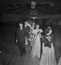 Grand March at Senior Prom Held in Gymnasium of Elementary School in Federal Housing Project, Greenbelt, Maryland, USA, Marjorie Collins for Farm Security Administration, June 1942