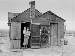 Wife and Child of Sub-Marginal Farmer, Pennington County, South Dakota, USA, Arthur Rothstein for Farm Security Administration (FSA), May 1936