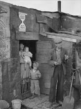 Family on Relief Living in Shanty on City Dump, Herrin, Illinois, USA, Arthur Rothstein for Farm Security Administration (FSA), June 1939