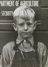 Migrant Boy, Tulare Migrant Camp, Visalia, California, USA, Arthur Rothstein for Farm Security Administration (FSA), March 1940